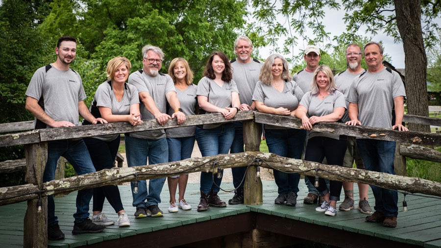 The staff of the Ohio Renaissnace Festival poses on the Y Bridge at Renassiance Park.