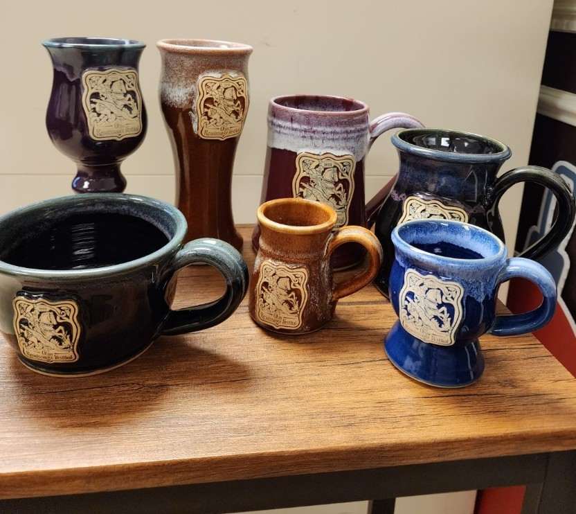 Ohio Renaissance Festival 2023 mugs on a table.