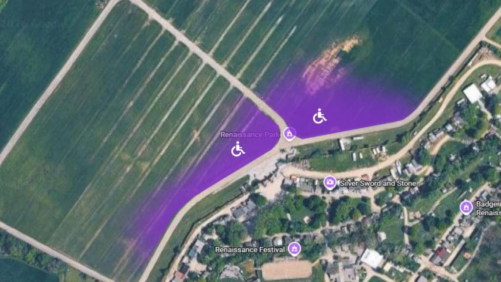 An annotated aerial map of the Renaissance Festival grounds, with a purple-shaded zone marking the handicapped parking area. Two white wheelchair icons within that zone indicate the designated accessible parking locations.