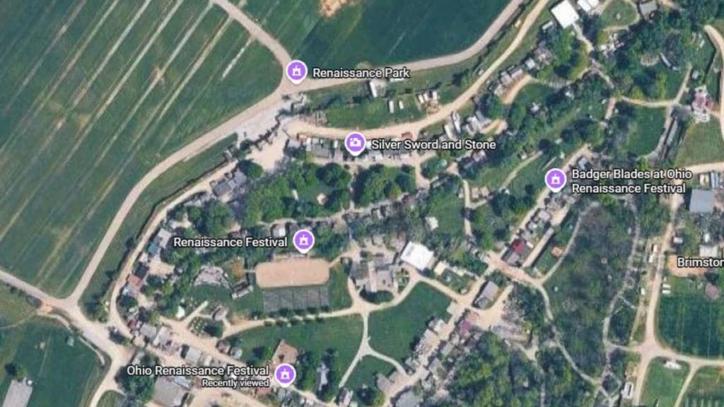  An unmarked Google Maps satellite view of the Ohio Renaissance Festival grounds, shown as reference for the real terrain. The view shows grassy areas, gravel paths, and trees.
